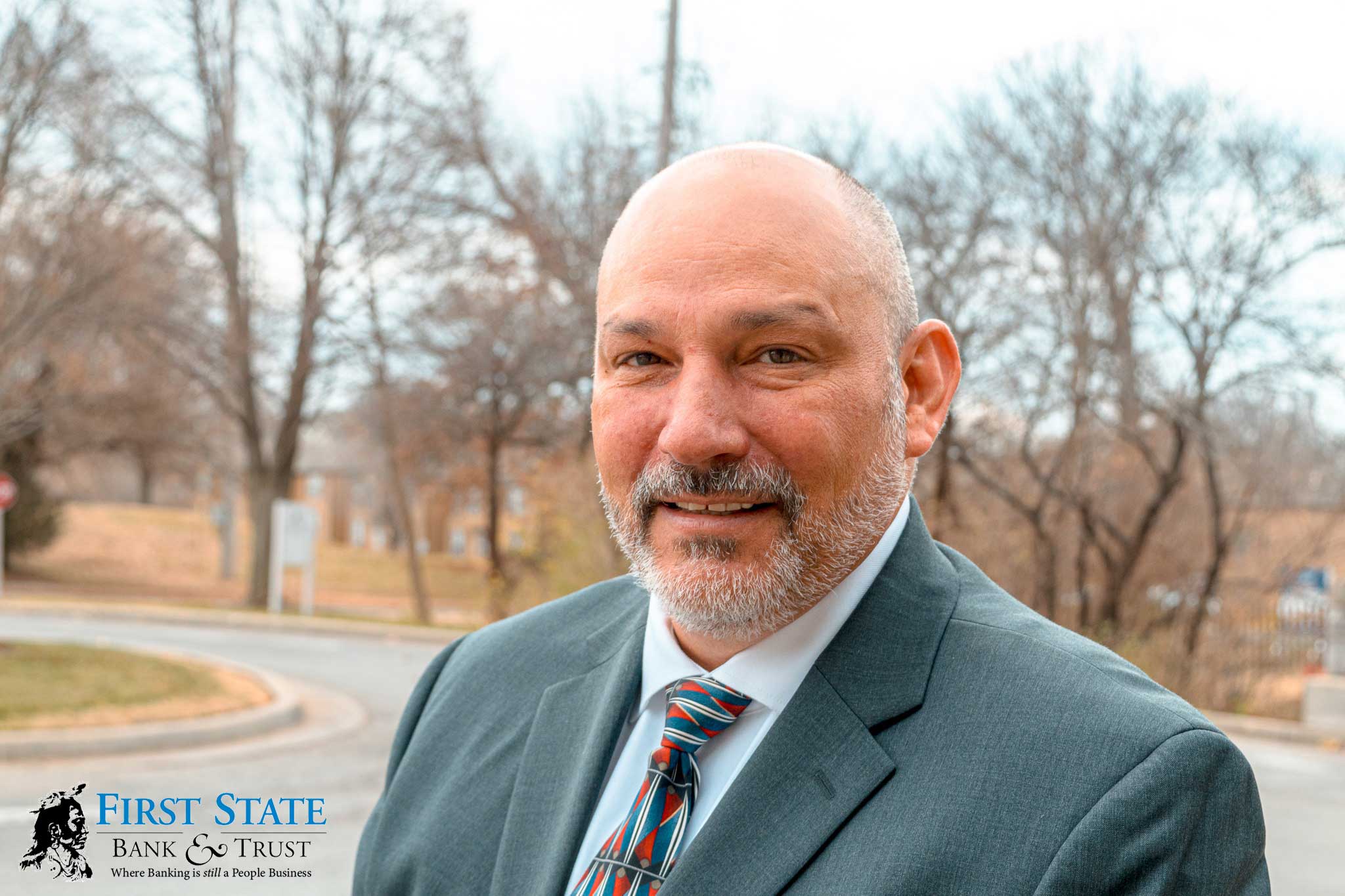 Marcus-with-Logo Local News Source press release about new loan officer at First State Bank.